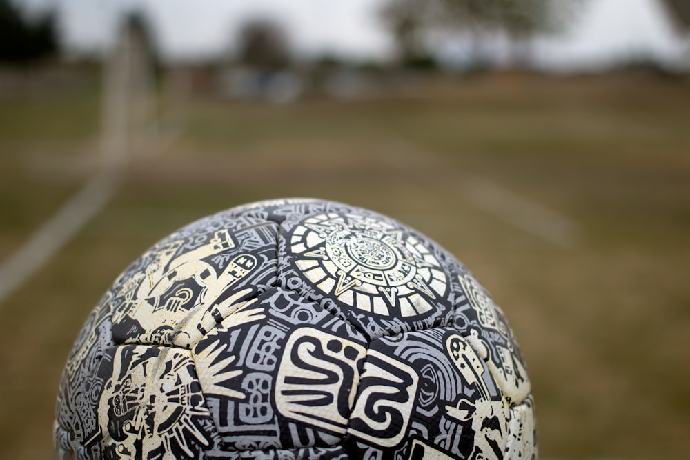 a close up of a soccer ball on a field