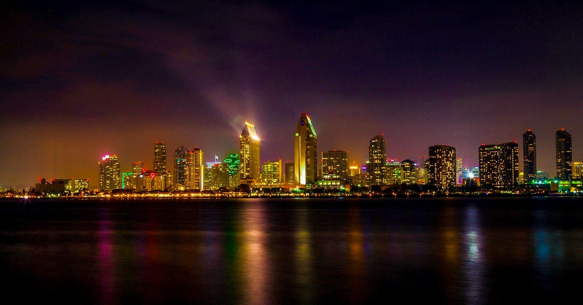 a view of a city at night from across the water