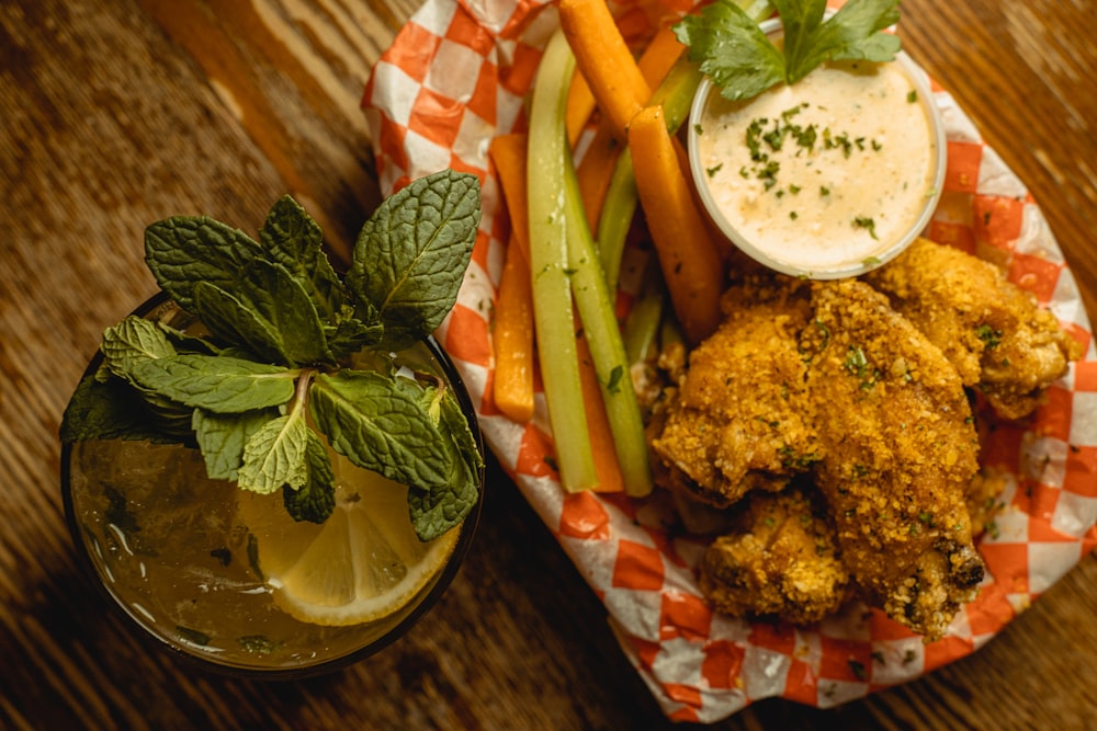 a plate of food and a drink on a table