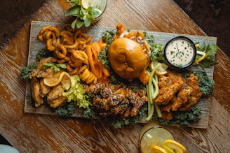 a wooden table topped with a plate of food