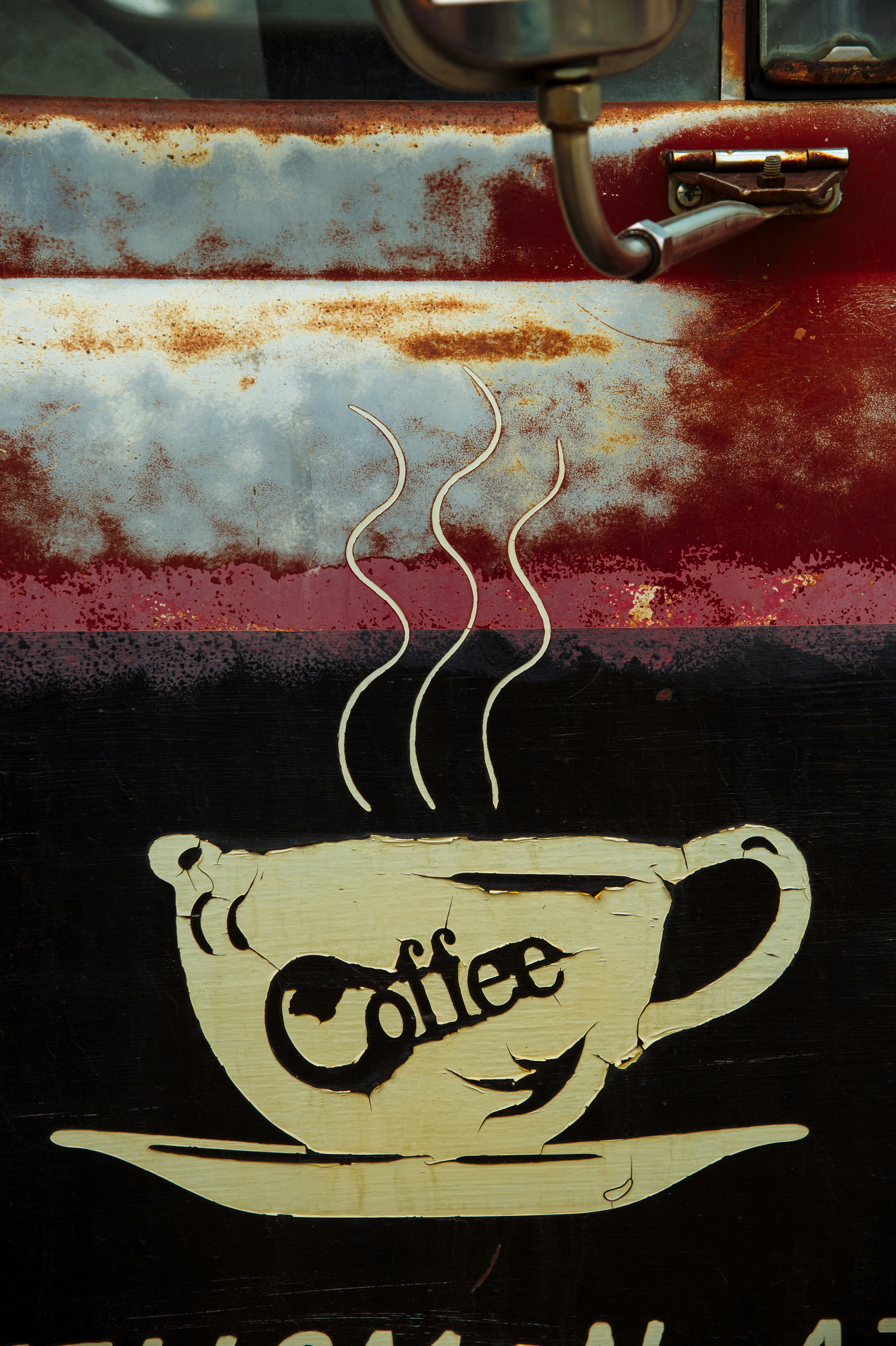 a coffee cup painted on the side of a truck