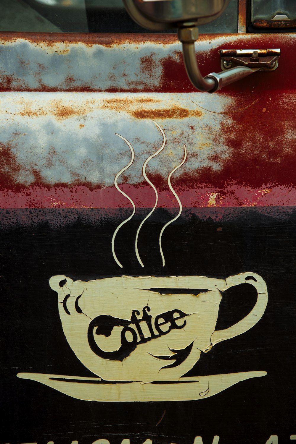 a coffee cup painted on the side of a truck