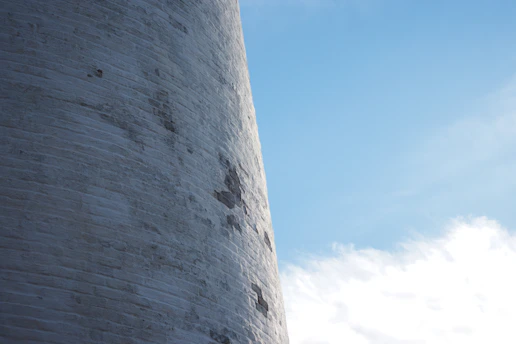 Close-up of a cracked brick wall on a UK residential house under soft daylight.