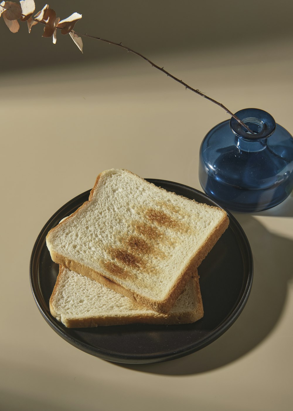 a black plate topped with two slices of toast