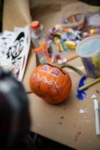 a pumpkin sitting on top of a wooden table