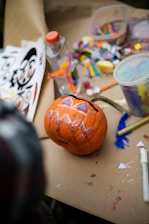 a pumpkin sitting on top of a wooden table