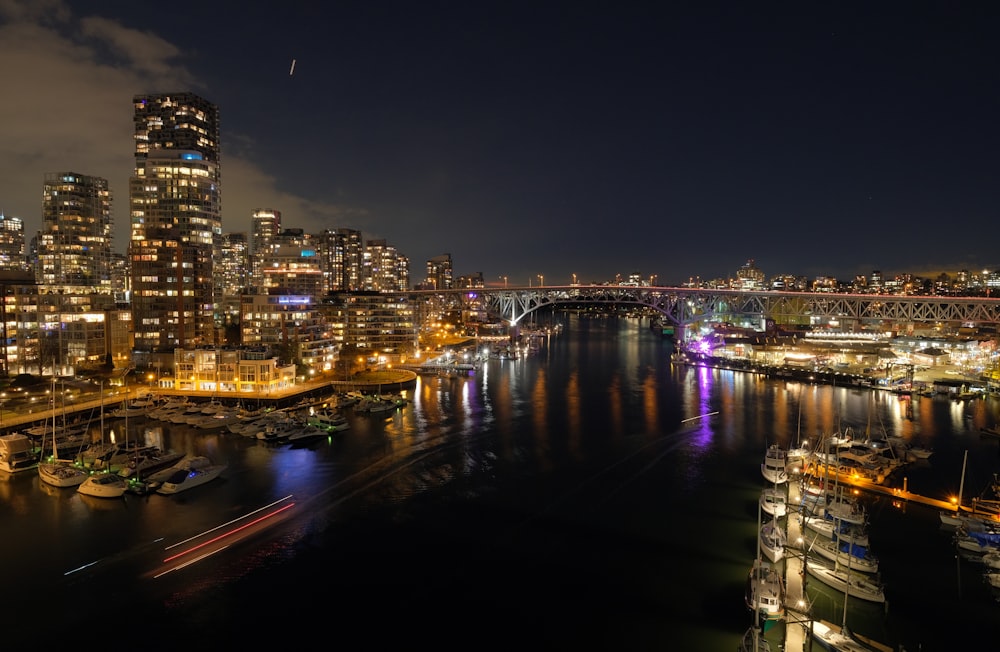 a view of a city at night from a bridge