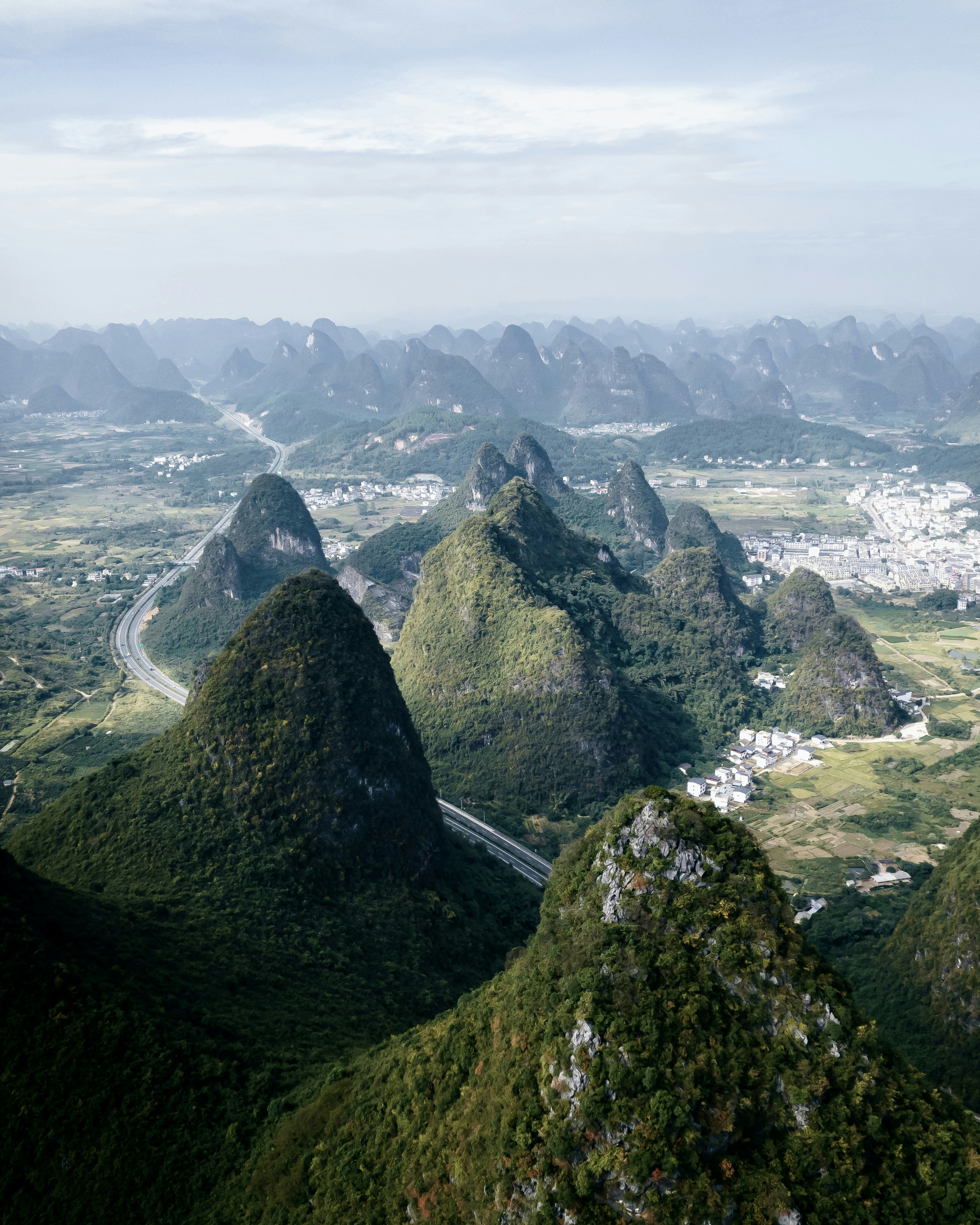 a scenic view of a mountain range with a river running through it