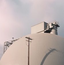 a large white building with a sky background