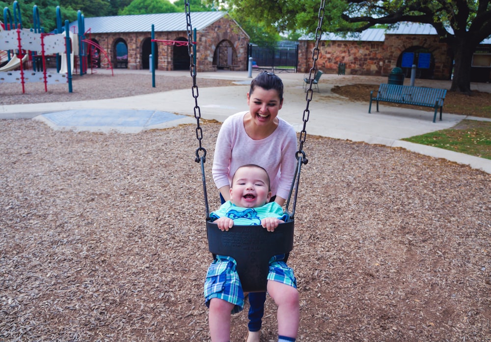 a little girl in a swing