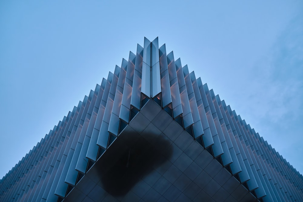 a very tall building with a sky in the background