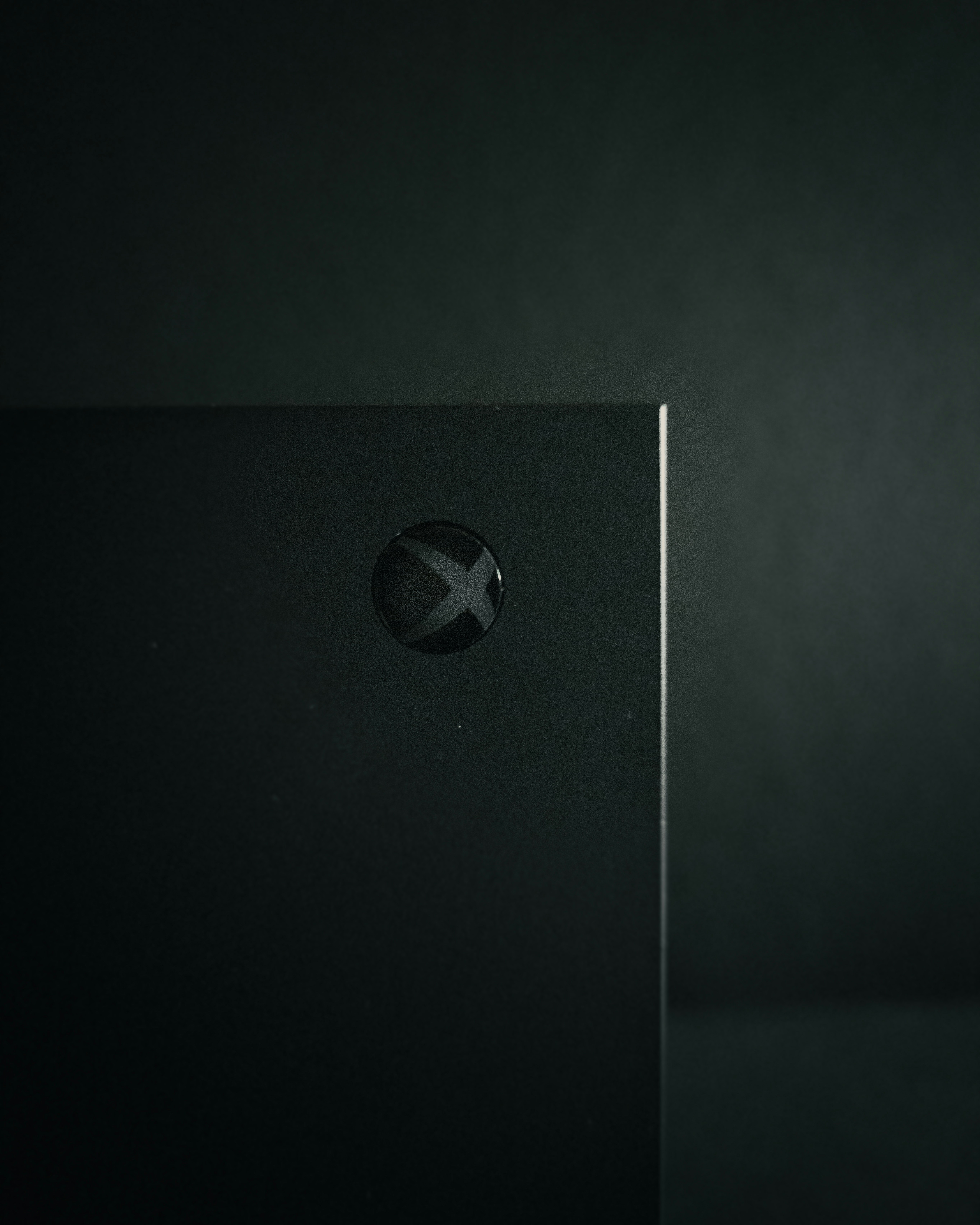 a close up of a metal object with a black background