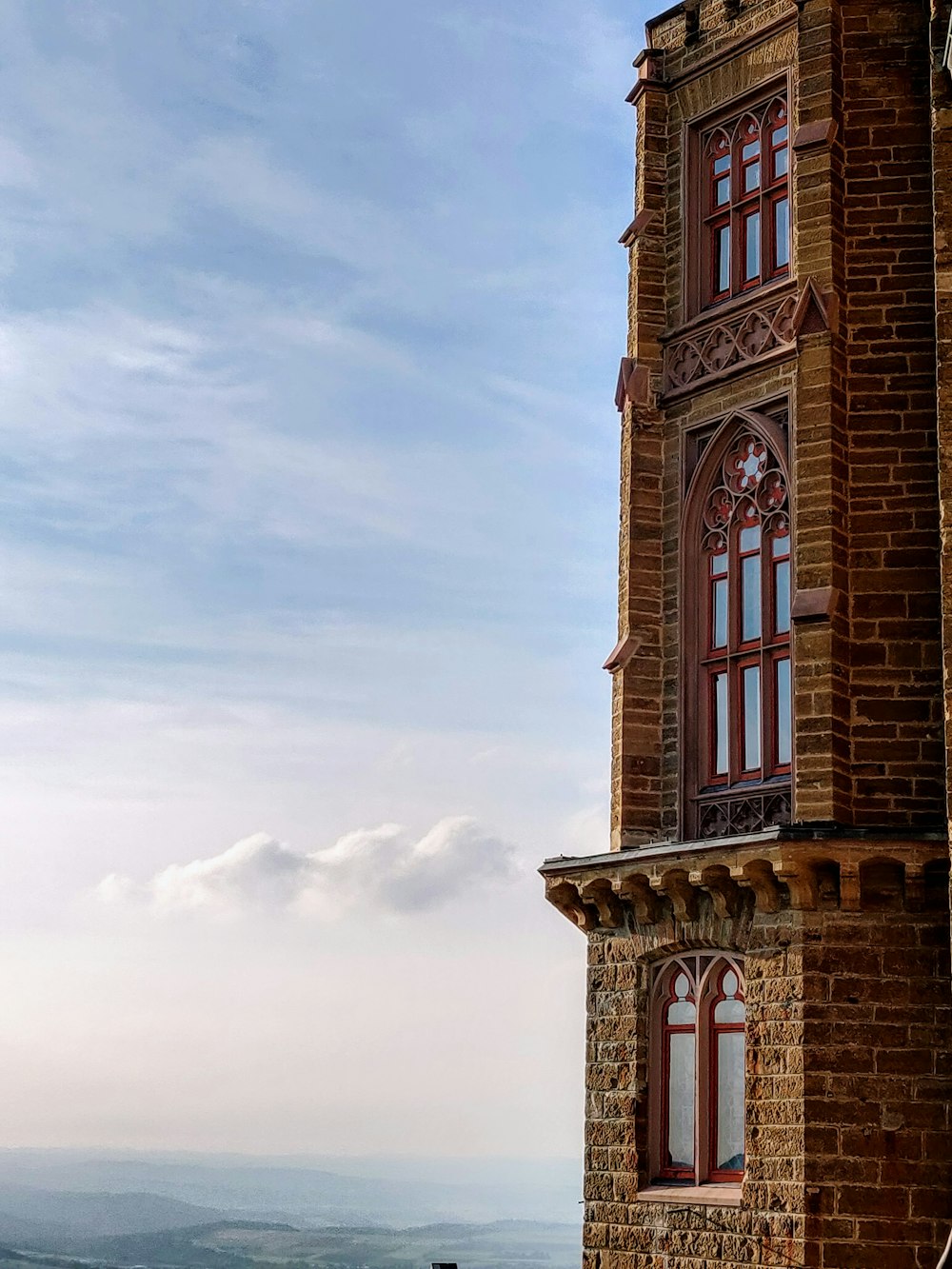 a tall tower with a clock on the top of it