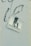 A weathered sticker is affixed to a rough-textured surface, depicting the silhouette of an adult holding hands with a child, next to a soccer ball. The words 'PASSION & FOOTBALL' are printed below the figures, suggesting a connection between family and the sport.