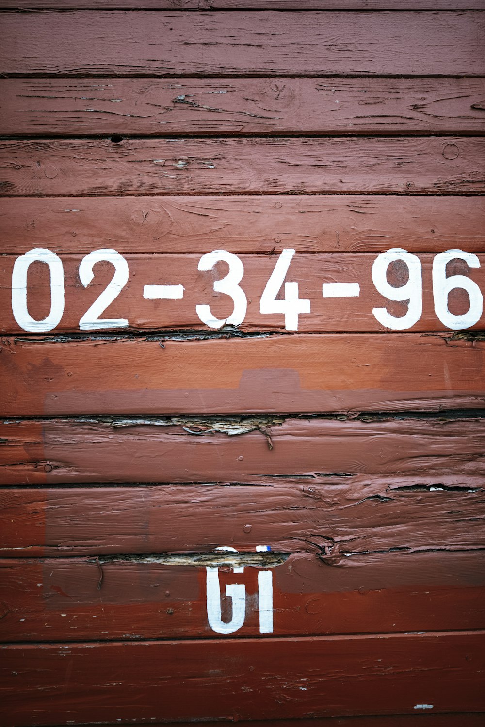 a close up of a wooden wall with numbers on it