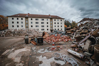 a pile of rubble sitting in front of a building