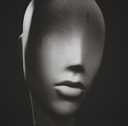 a black and white photo of a mannequin's head