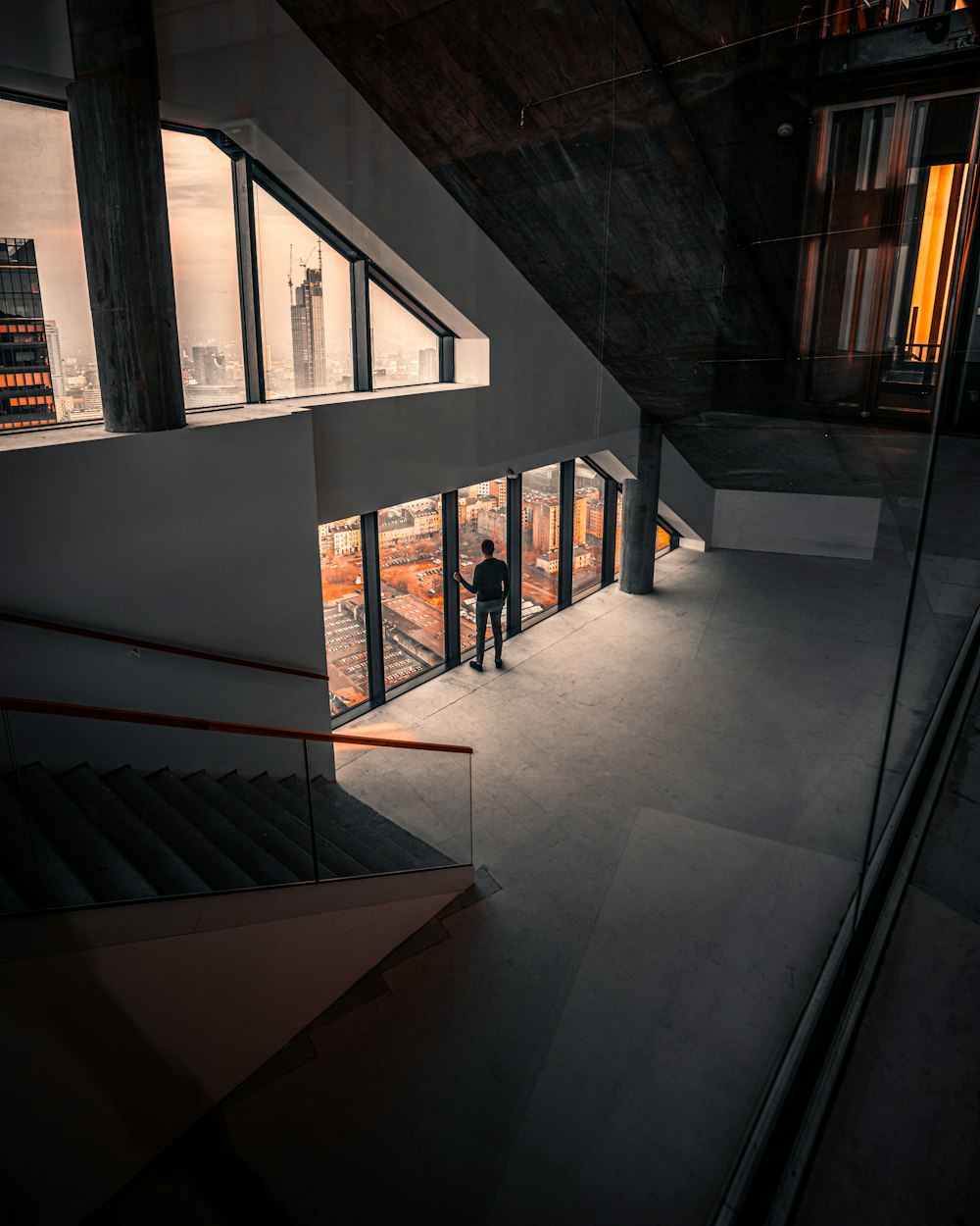 a couple of people that are standing in front of a building