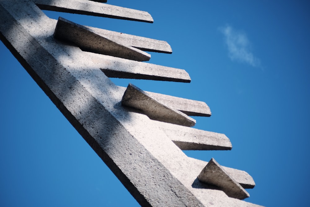 a close up of a sculpture against a blue sky