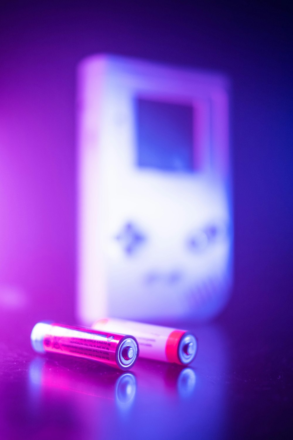 two batteries sitting on top of a table