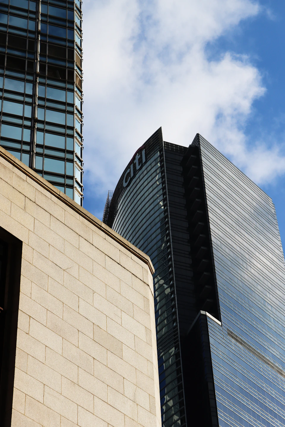 Cityscape features three distinct buildings in various architectural styles and colors prominently