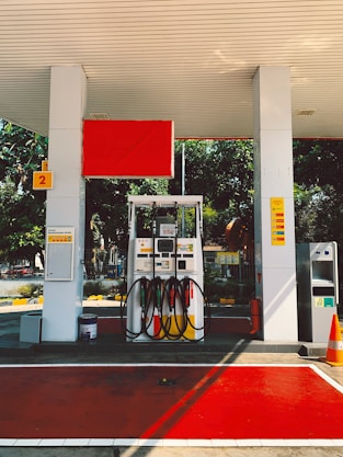 a gas station with a red carpet on the floor