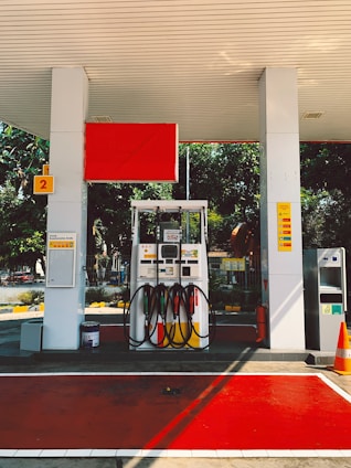 a gas station with a red carpet on the floor