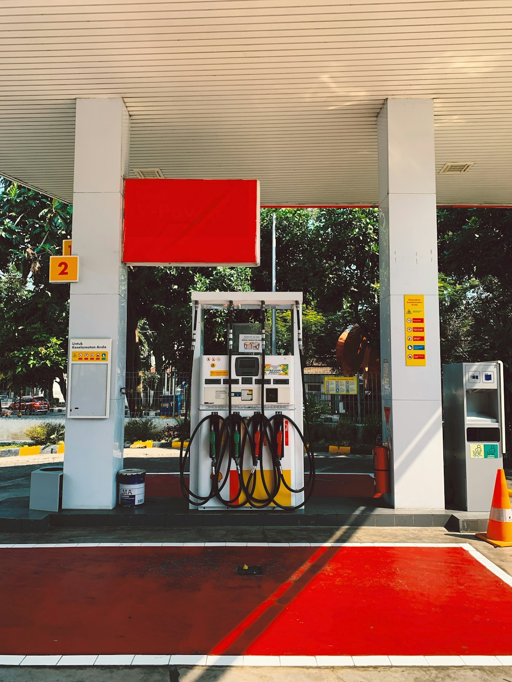 a gas station with a red carpet on the floor