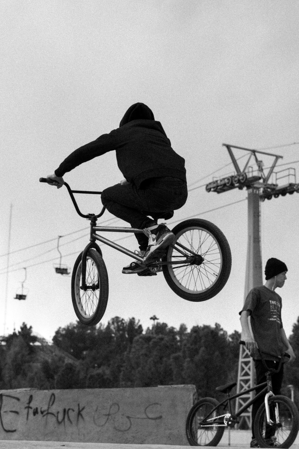 a man flying through the air while riding a bike