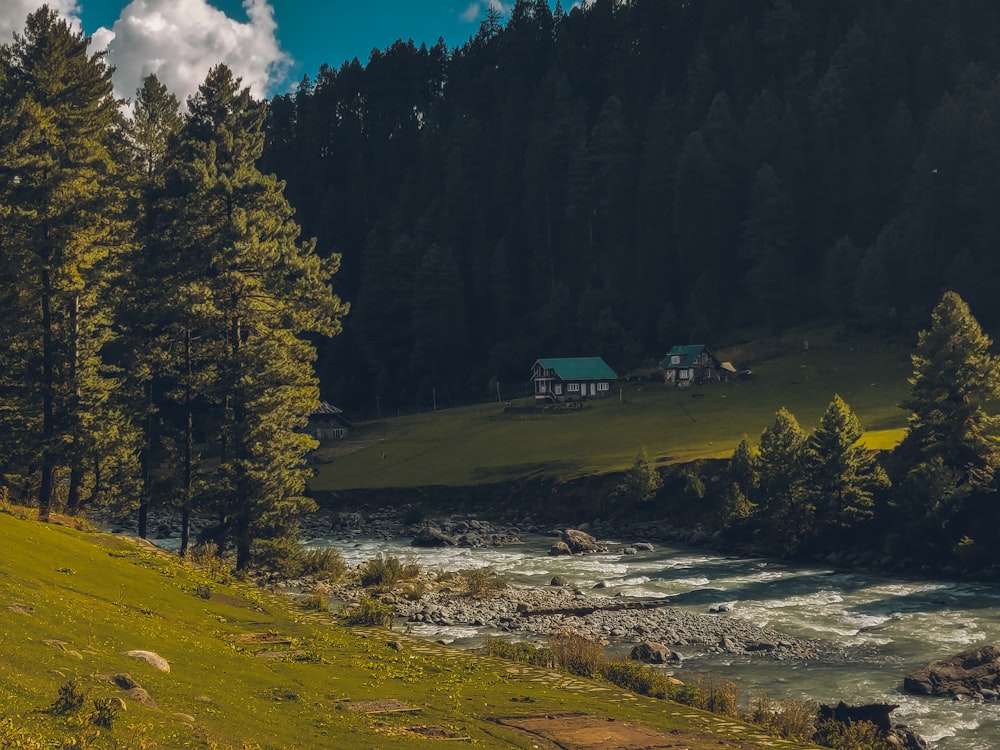 a house on a hill near a river