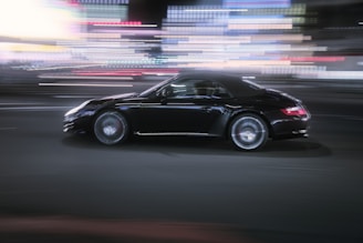 Screenshot of a vibrant racing game with sleek cars speeding through city streets at night.