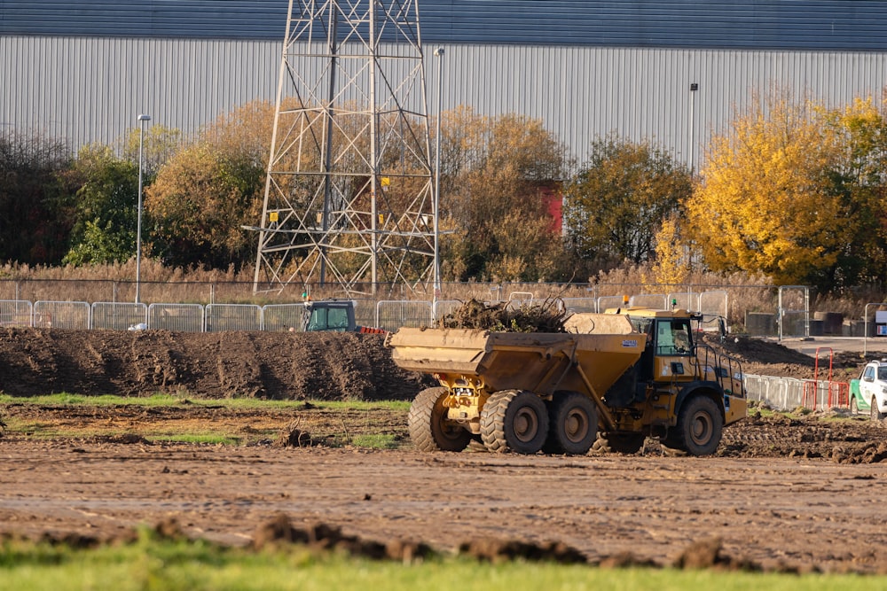 a large truck driving down a dirt road