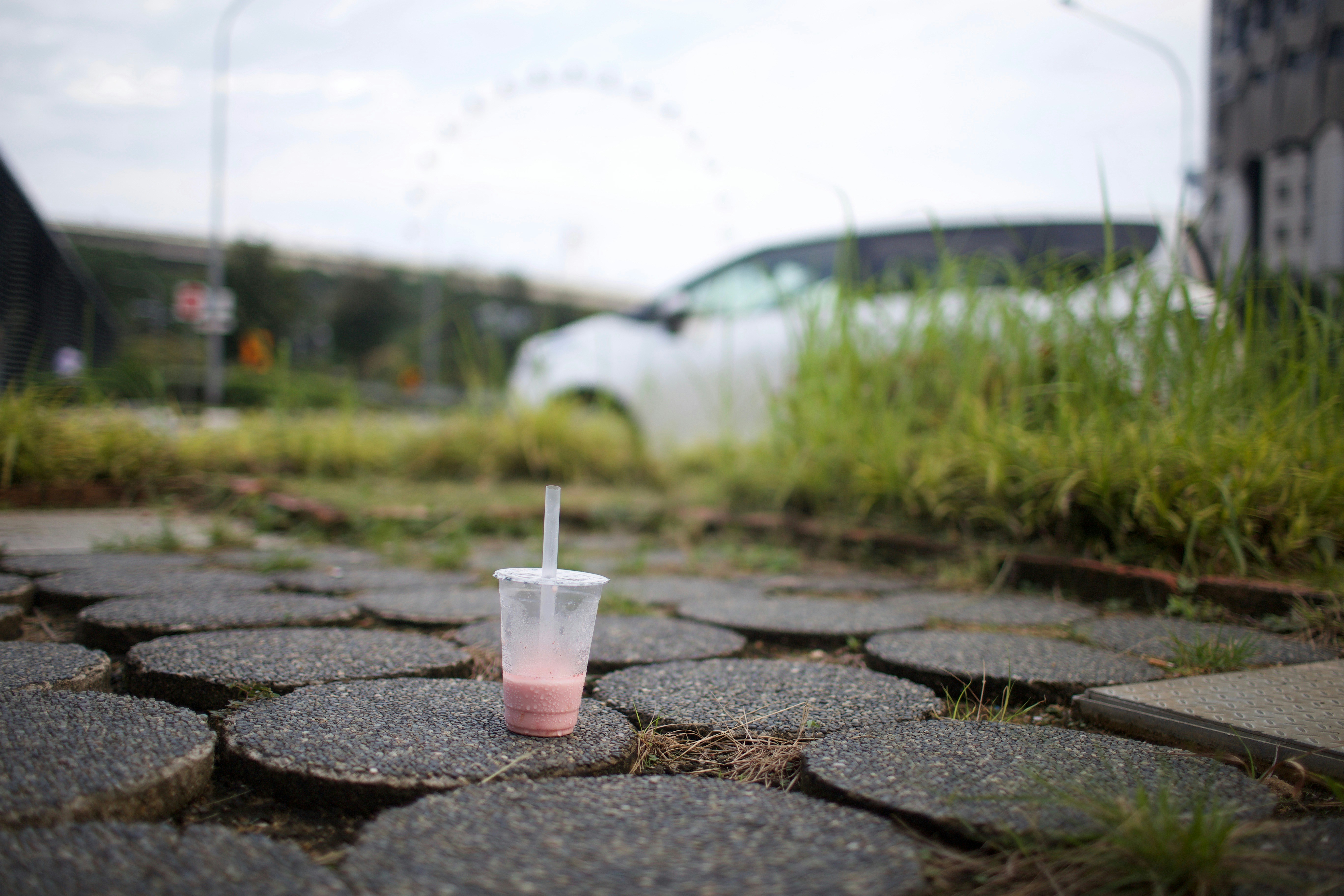 a plastic cup with a straw sticking out of it