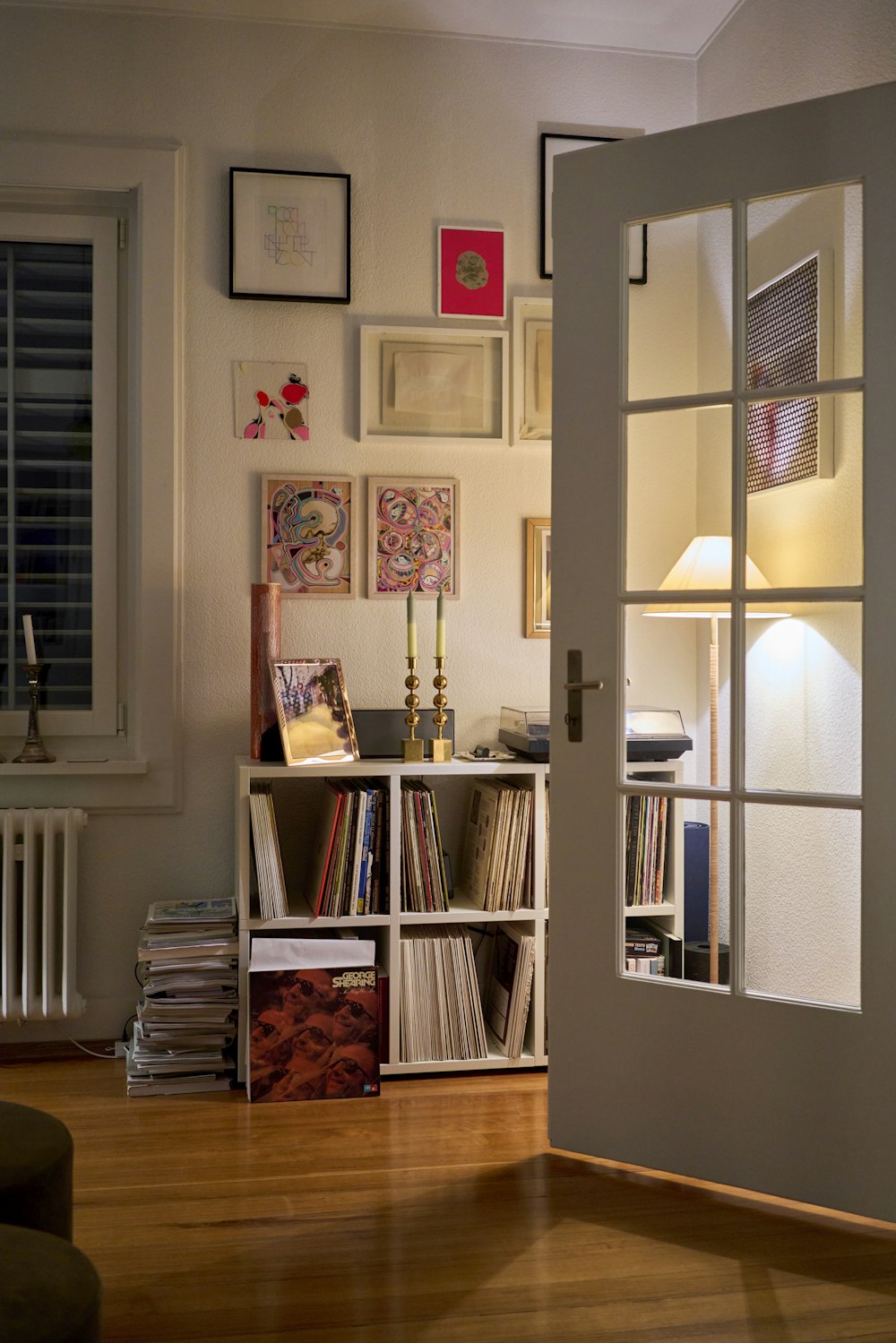 a living room with a book shelf filled with books