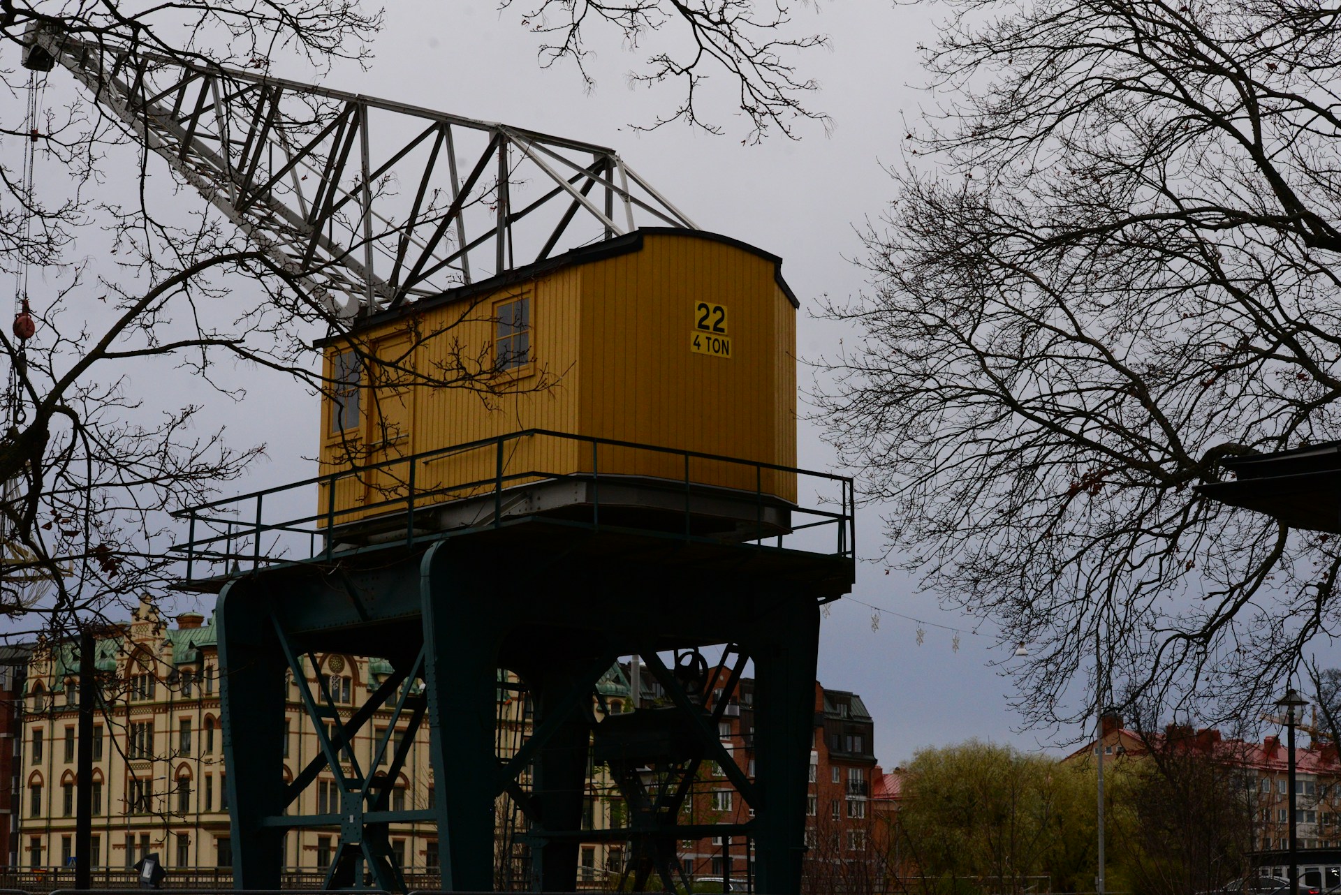woman wearing yellow long-sleeved dress under white clouds and blue sky during daytime