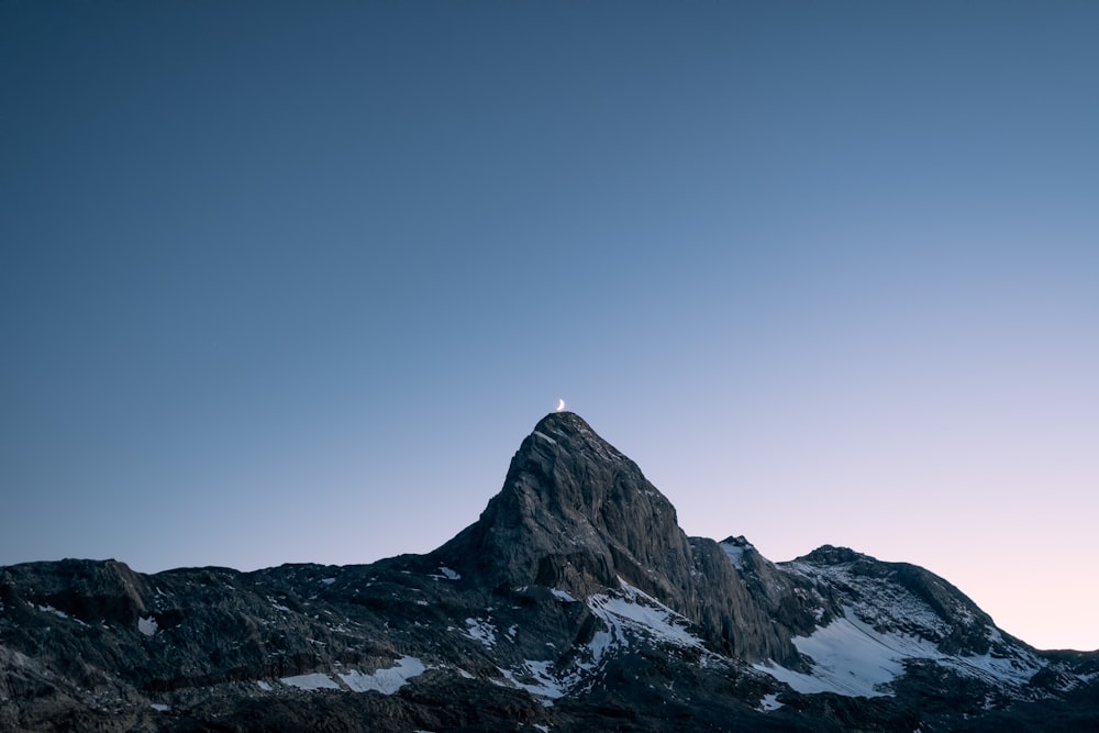 a mountain with a snow covered peak in the distance