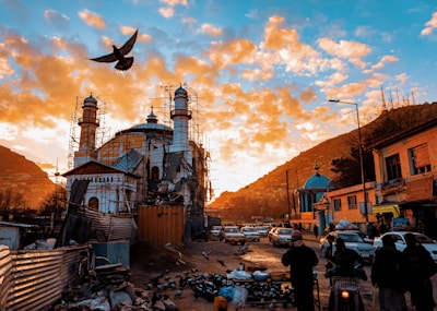 Sunset over a bustling street in a Middle Eastern city where the mission operates.