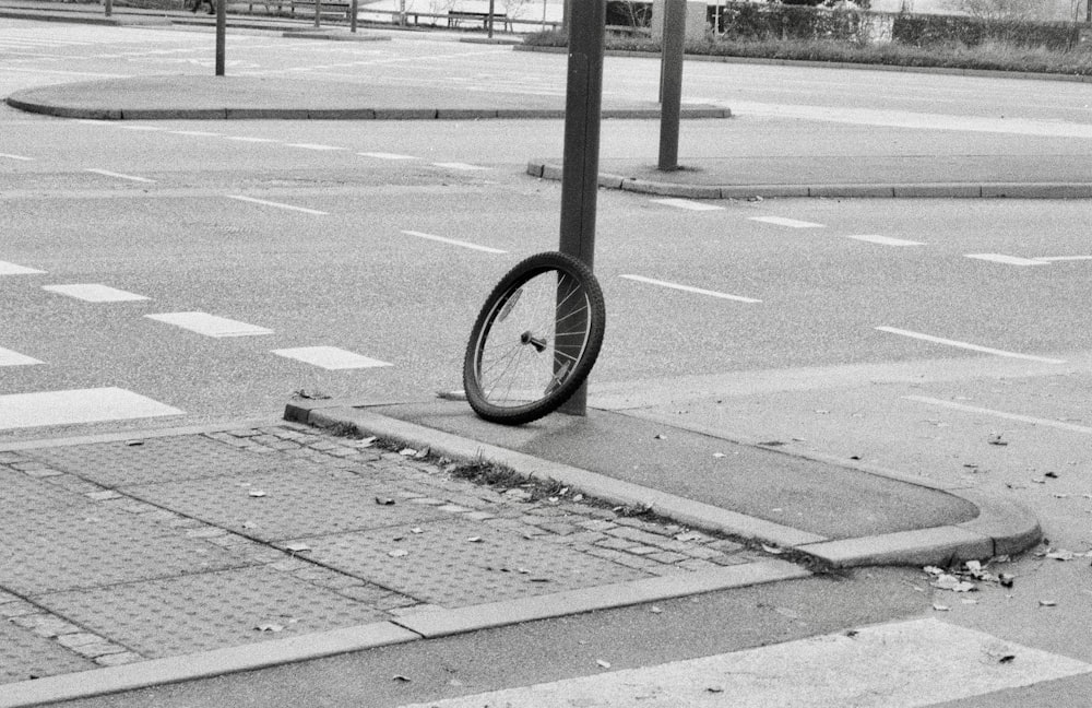 a bicycle tire on the side of a street