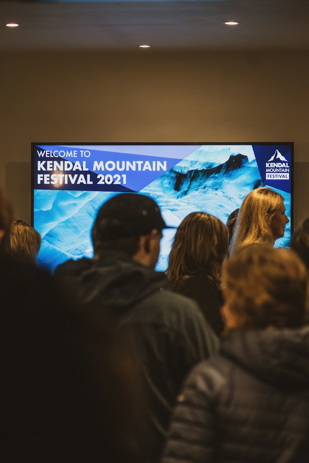 a group of people watching a television show