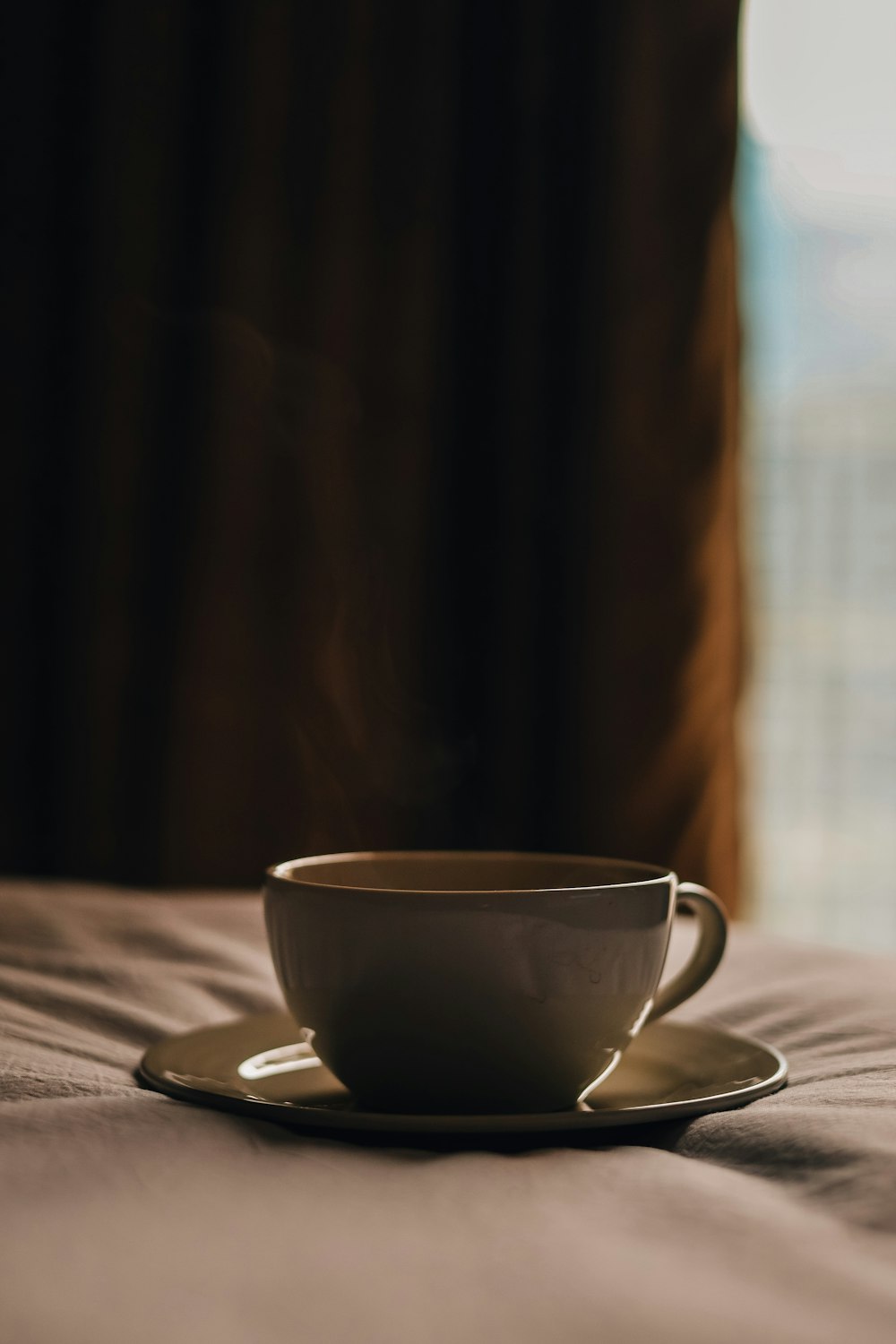 a close up of a coffee cup sitting on a table