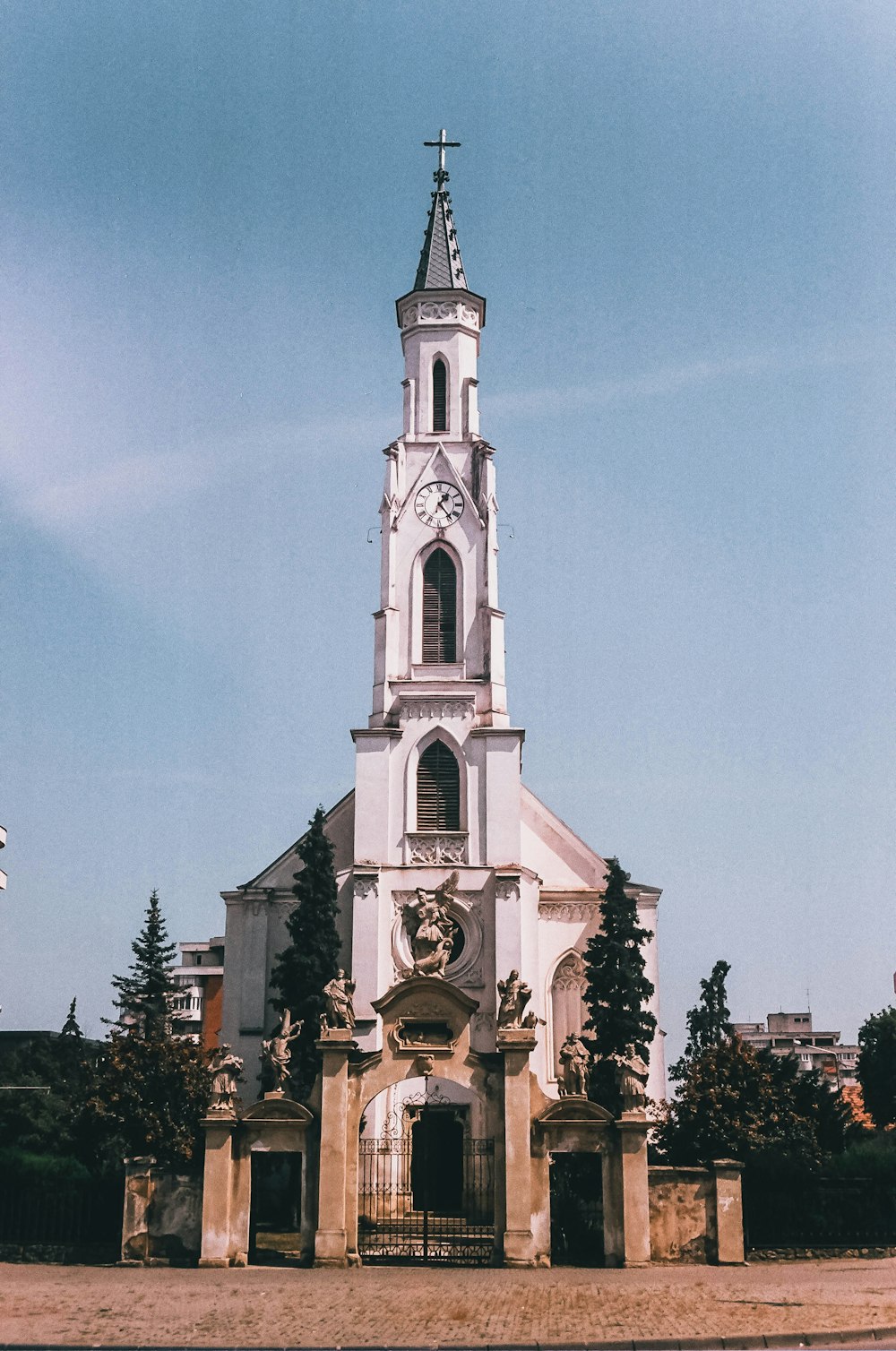 a large white church with a clock tower