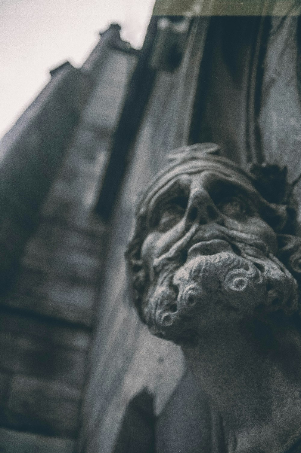 a close up of a statue on a building