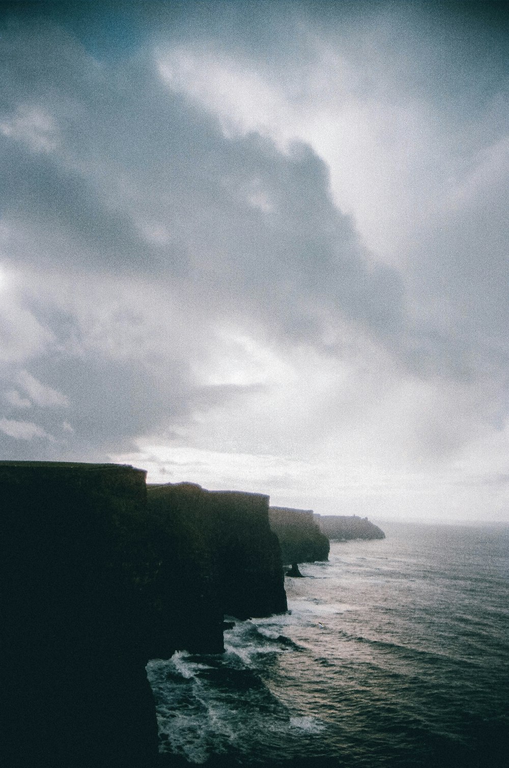 a view of the ocean from a cliff