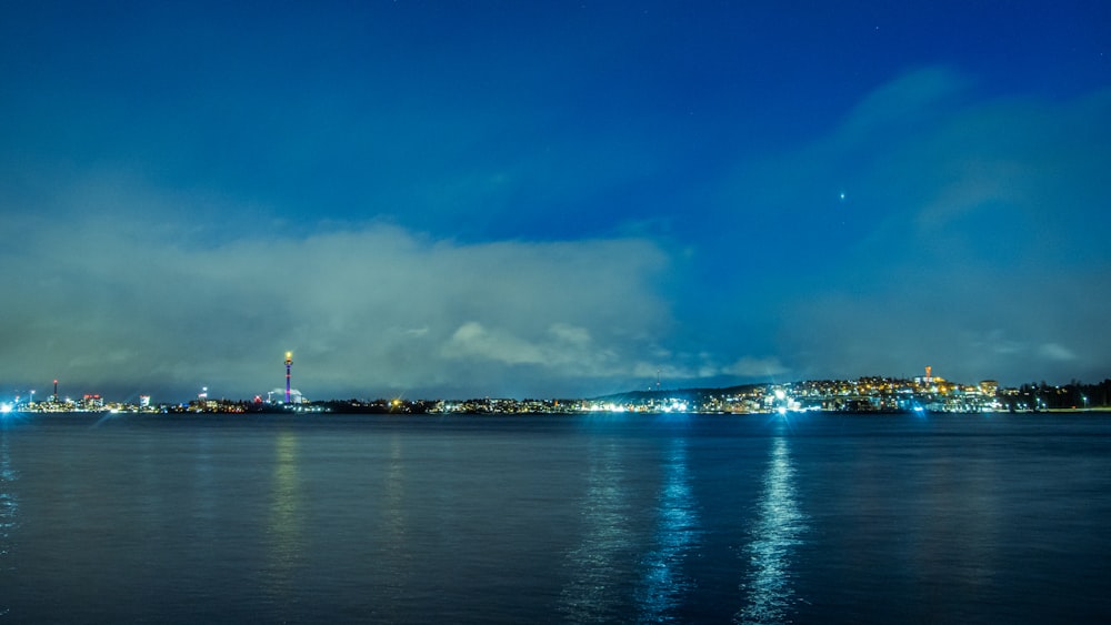 a view of a city at night from across the water