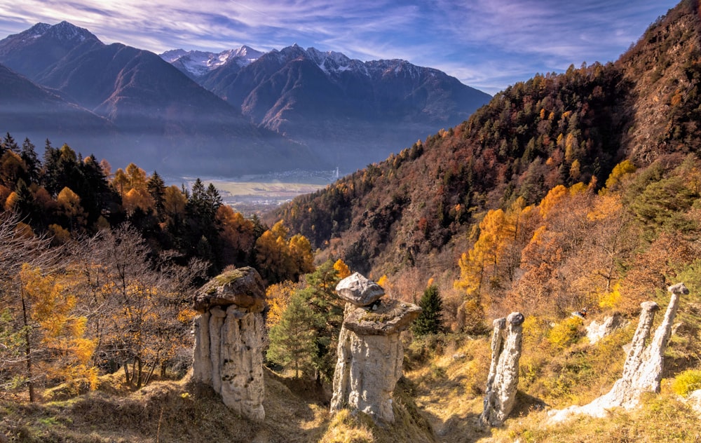 a scenic view of a mountain range in autumn