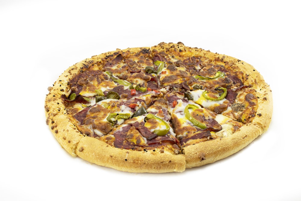 a pizza with various toppings on a white background