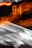 A blurred image featuring streaks of light and glowing orange numbers. The numbers '94' are visible, set against a dark background with motion blur effect creating dynamic lines.