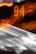 A blurred image featuring streaks of light and glowing orange numbers. The numbers '94' are visible, set against a dark background with motion blur effect creating dynamic lines.
