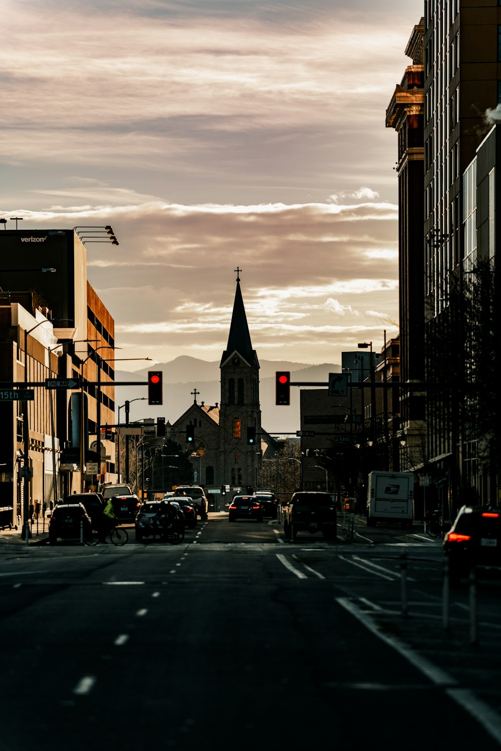 a city street filled with traffic and tall buildings