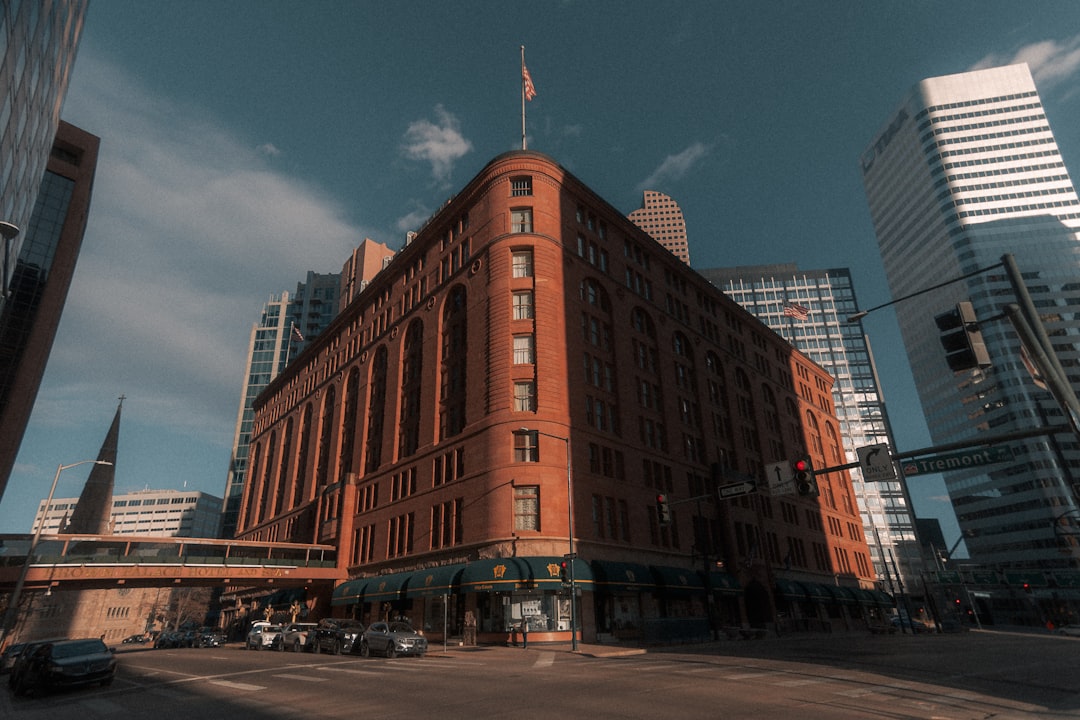 a large red brick building sitting on the corner of a street,